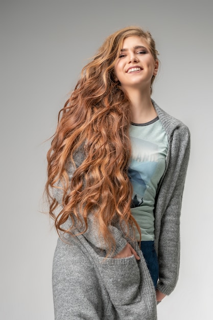 Fashionable woman posing on white background