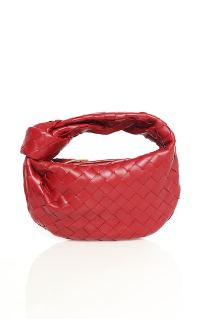 Fashionable woman's stylish bag isolated on white background. Beautiful red luxury  leather female handbag . Luxury accessories.