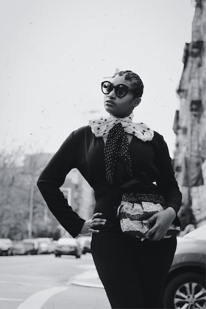 Fashionable woman standing in city