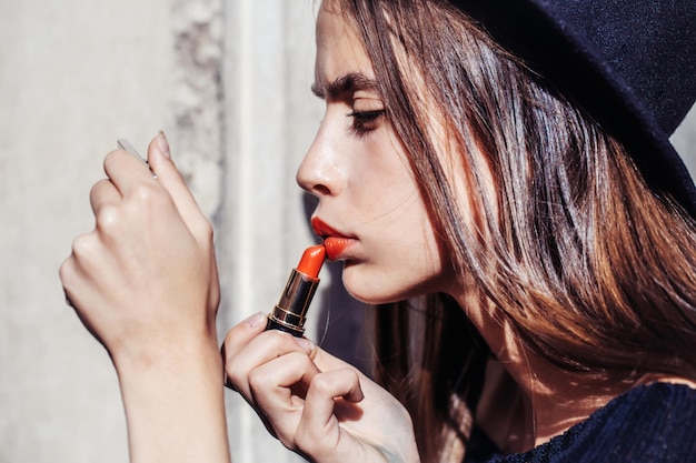 Fashionable woman with red lipstick