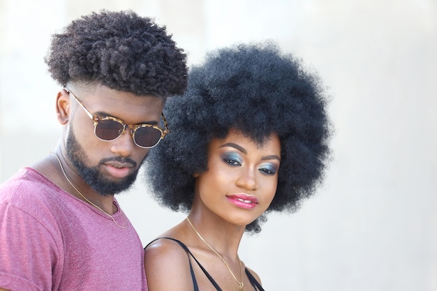 Fashionably dressed young black man and woman