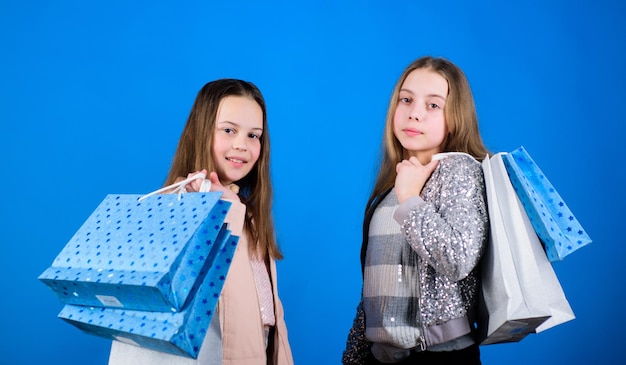 Fashionista addicted buyer Fashion boutique kids Shopping of her dreams Happy children in shop with bags Shopping is best therapy Shopping day happiness Sisters shopping together Buy clothes