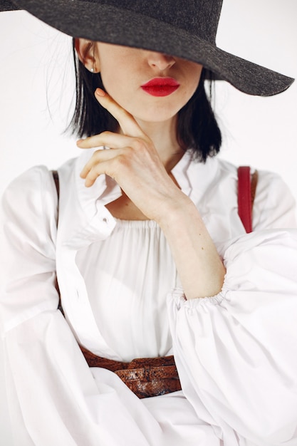 Fashionista girl. Woman on a white background. Stylish lady.