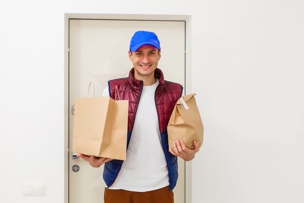 Fast delivery service manager bringing package to female client