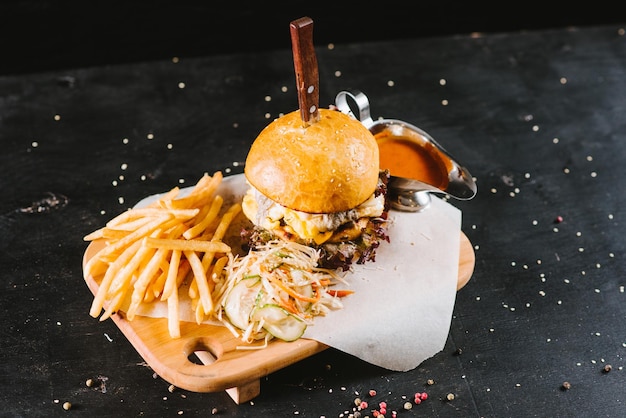 Fast food burger with fries and sauce