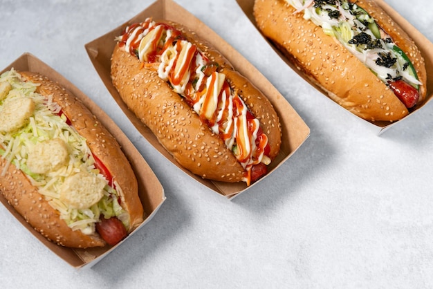fast food hot dog banner on a light grey stone textured background, hotdog menu template
