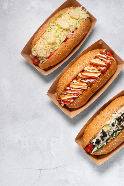 fast food hot dog banner on a light grey stone textured background, hotdog menu template