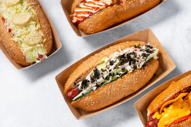 fast food hot dog banner on a light grey stone textured background, hotdog menu template