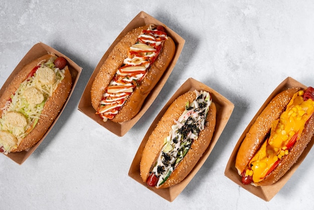 fast food hot dog banner on a light grey stone textured background, hotdog menu template