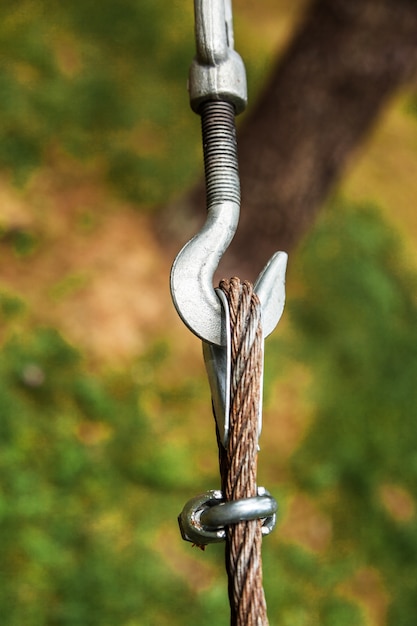 Fastening of a cable and a metal hook