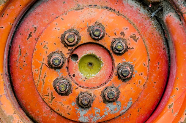 Fastening the wheel of an old combine Rusty nuts