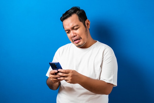 Fat Asian guy wearing a white T-shirt isolated