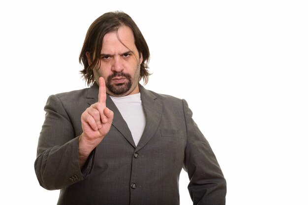 Fat Caucasian businessman looking angry with finger up isolated on white