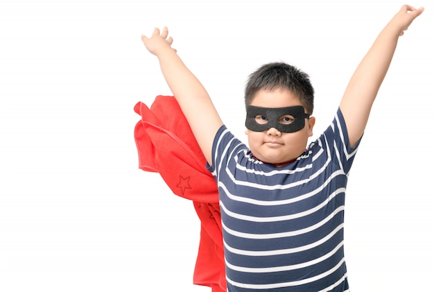 Fat child plays superhero isolated on white 