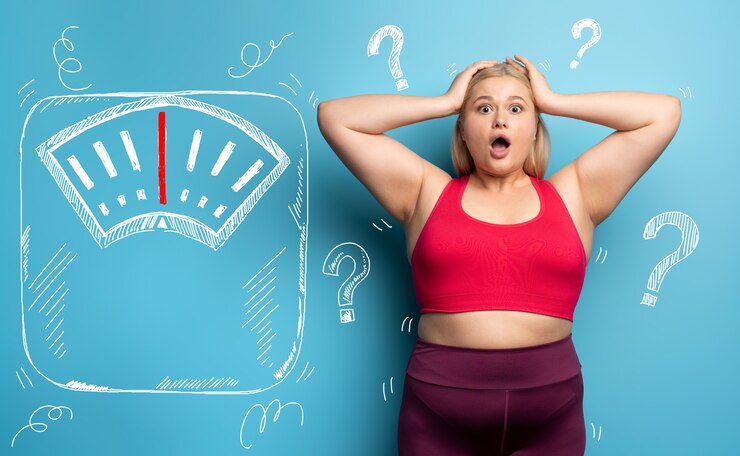 Fat girl is worried because the scale marks a high weight