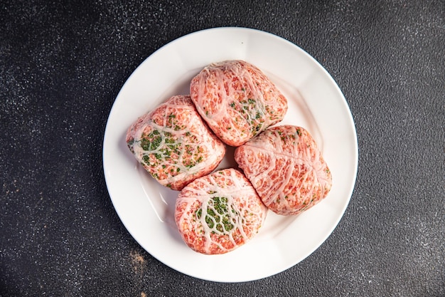 Fat grid cutlets fatty mesh meat pork, beef raw minced meat and\
spices fresh delicious snack