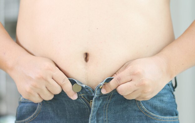 Fat Man Trying Put On Pants Stock Photo 631901717