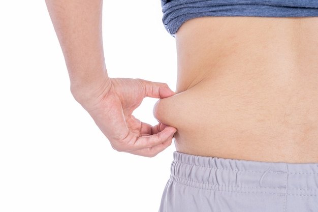 Fat man holding excessive fat belly isolated white background