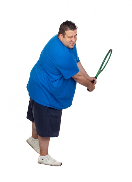 Fat man with a racket playing tennis isolated on white background