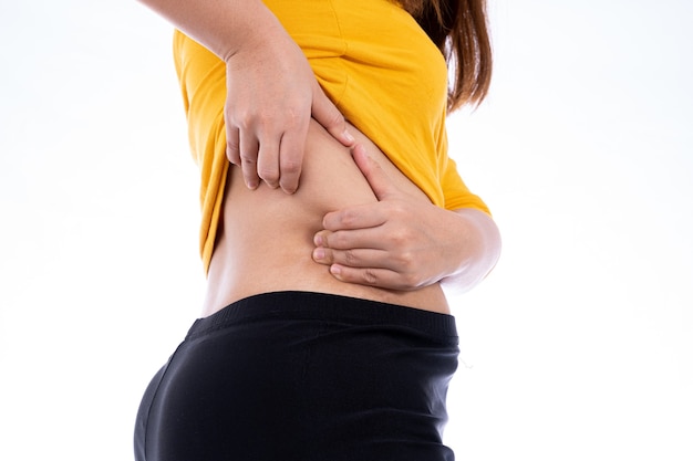 Fat woman holding excessive lower back isolated white background