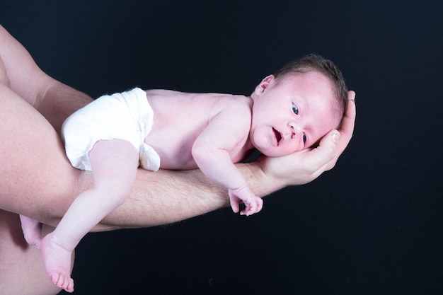 In father arms newborn baby