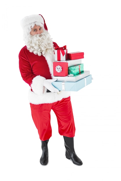 Father christmas holding many gifts 