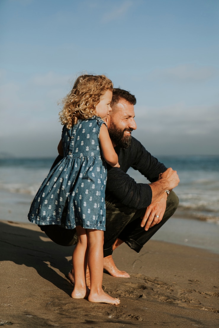 Photo father and daughter at a beach