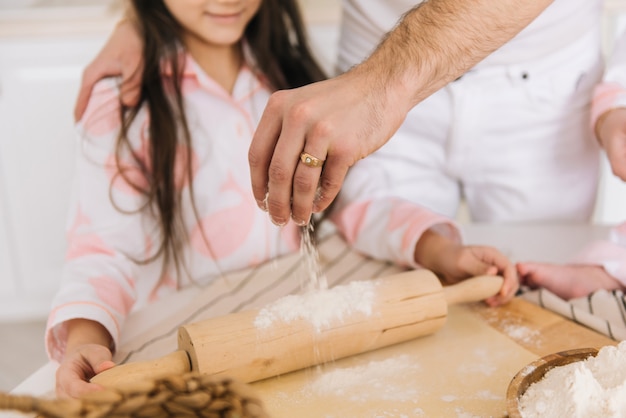 Father and daughter cooking together