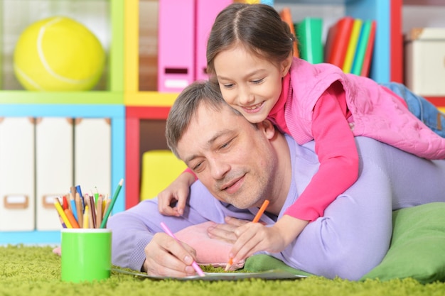 Father and daughter drawing pictures
