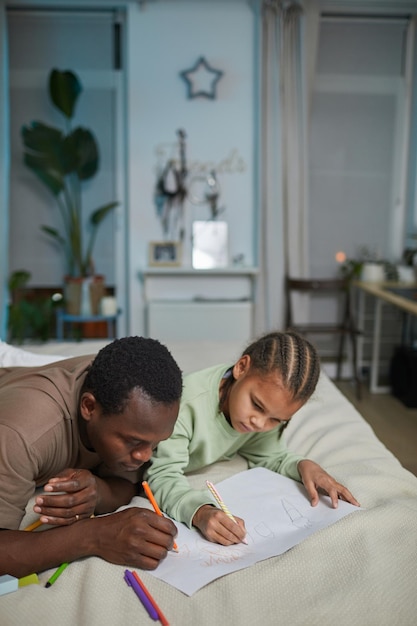 Father and Daughter Drawing Together