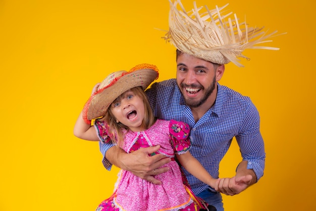 Father and daughter dressed in June party clothes Young daddy and little daughter ready for june party Copy space