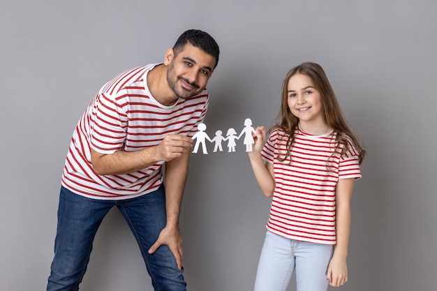 Father and daughter holding paper chain people together happy family relationships childhood