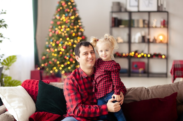 Father and daughter at home at Christmas