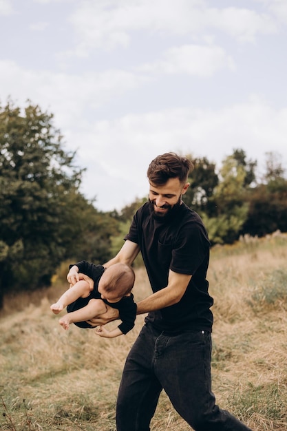 Father and daughter in the park dancing and holding hands