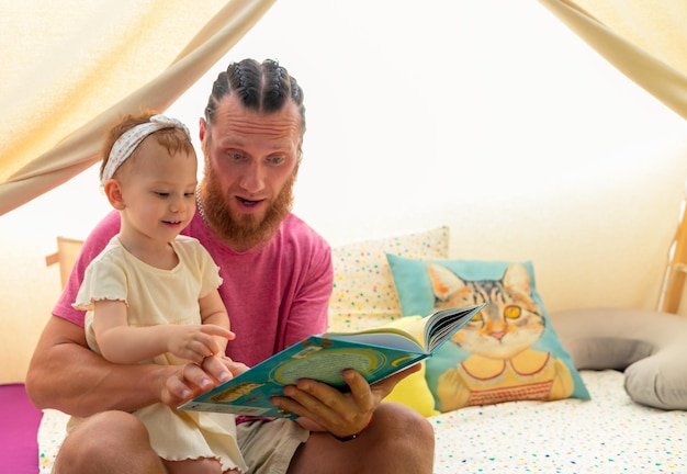 Father and daughter reading a book