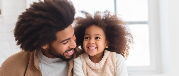 Photo a father and daughter smile together in front of a window