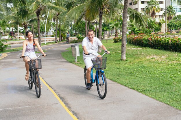 Father and daughter spending free time on bicycles in the city