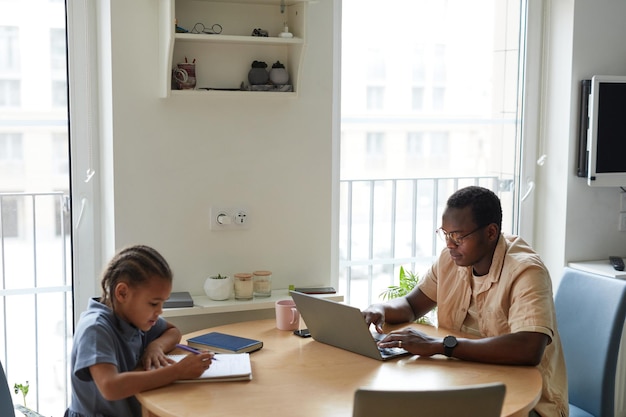 Father and Daughter at Table