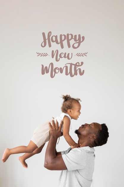 Father and daughter with happy new month lettering