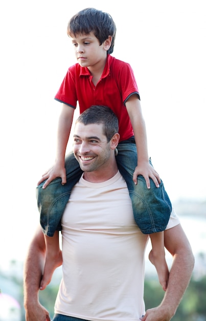 Father giving son piggyback ride