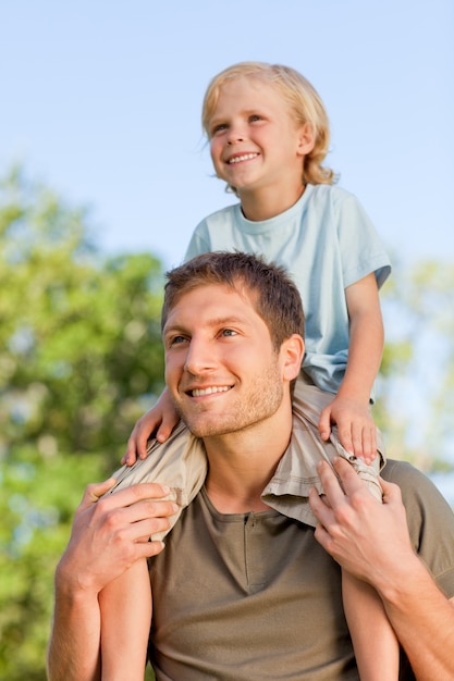 Father giving son a piggyback