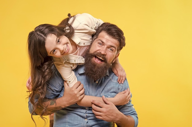 Father and happy little daughter having fun lovely hug concept