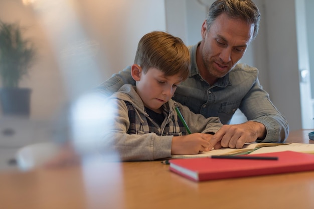 father helping his son with his homework