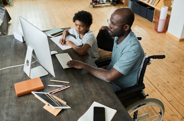 Father helping his son with studying