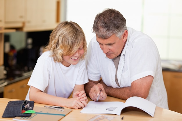 Father helping son with homework