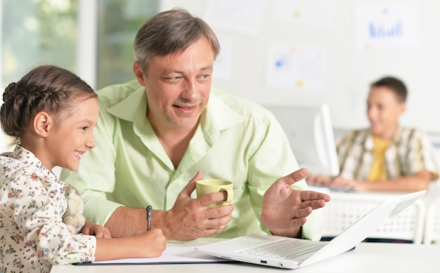 Father helping son with homework