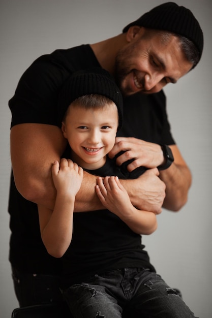 Father and his 6 years old son fooling around