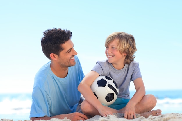 Father and his son with a ball