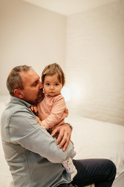 Father holding a baby girl