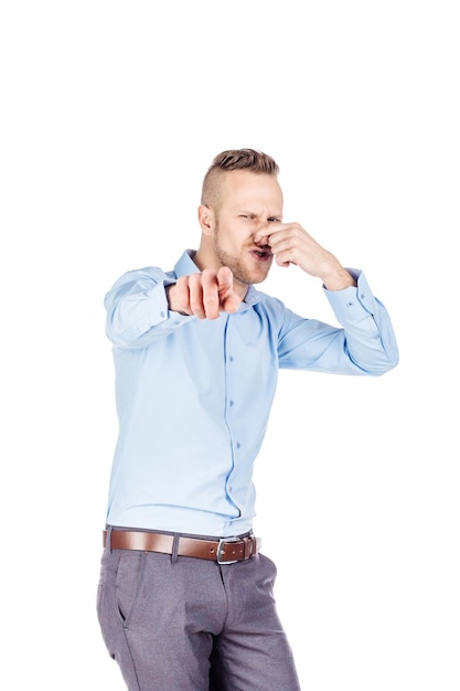 Father holding dirty dirty diaper in one hand fingers over white background Unpleasant smell stink